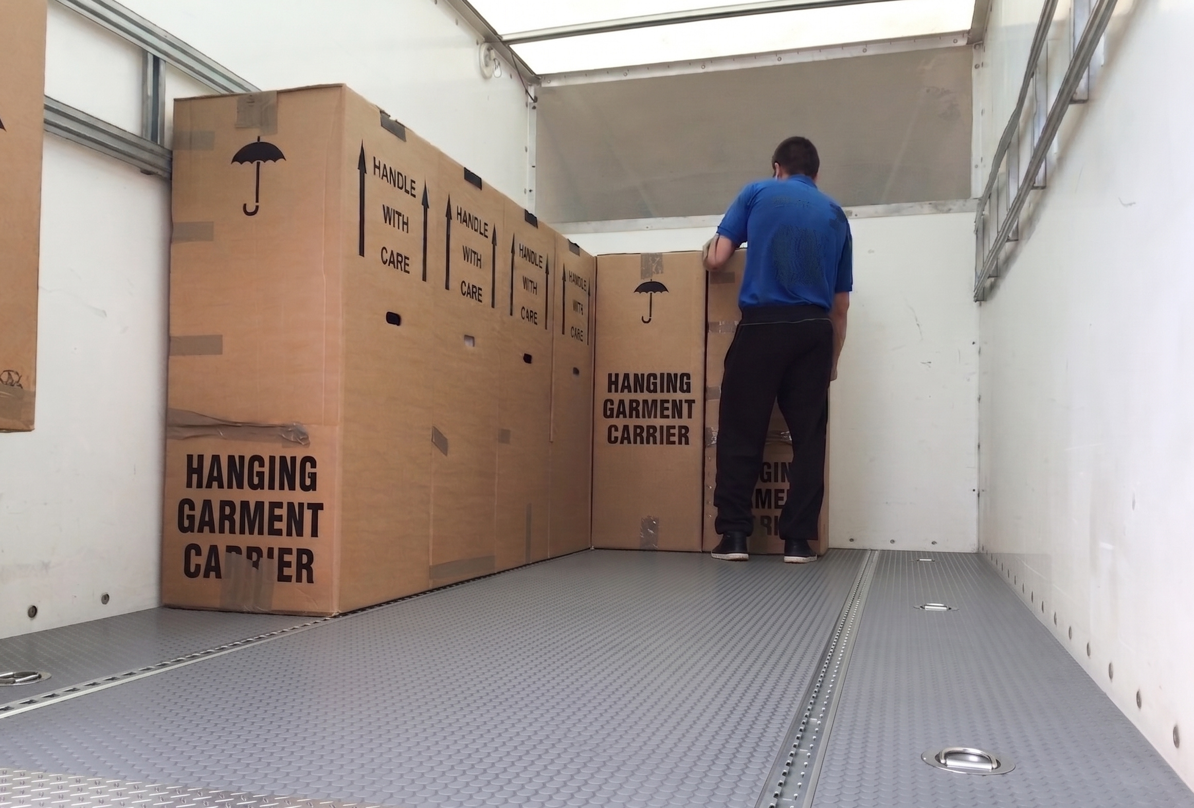 Removal van being loaded with removal boxes